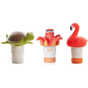 Three colourful floating chlorine dispensers shaped like a turtle, octopus, and flamingo, each with a white base.