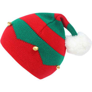 A red and green knitted beanie with a plush white pom-pom and golden accents. It features a festive design for Christmas.