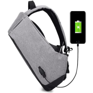 A grey travel backpack featuring a USB charging port and a connected smartphone displaying a battery icon.