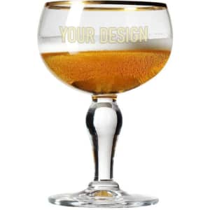 A crystal beer mug featuring a clear bowl and a sturdy base, showcasing a golden beverage inside.