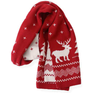 A red double-sided Christmas scarf featuring white patterns of reindeer and trees. It has a knitted texture and logo.