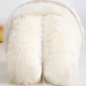 Fluffy white earmuffs with a soft texture and a band, designed for personalised winter wear.