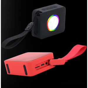 A black mini waterproof speaker with a colourful light and a red hexagonal speaker with a strap and ports.