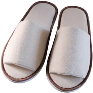 Custom open toe cotton disposable slippers in a beige colour with brown accents. Features a soft, textured fabric and a simple design.