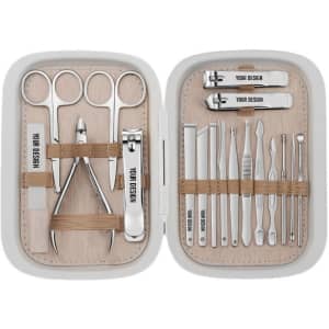 A personalised nail clipper kit in a light grey case, featuring stainless steel tools for nail care and grooming.