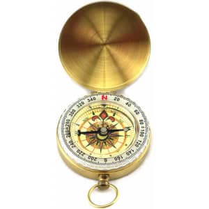 A brass compass with a decorative face and a protective lid, featuring a keyring attachment.