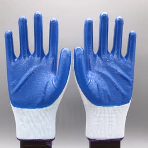 Latex coated working gloves with blue palms and white fabric wrist cuffs, featuring a logo on the design.