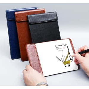 A magnetic folding clipboard in brown, black, and blue PU leather, with an illustration being drawn on it.