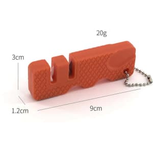 A red knife sharpener keychain with a textured grip, featuring a small chain for attachment.