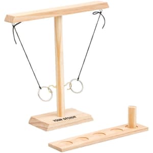 A wooden hook and ring game set featuring a tall, T-shaped stand with black strings and metal rings, plus a base with holes.
