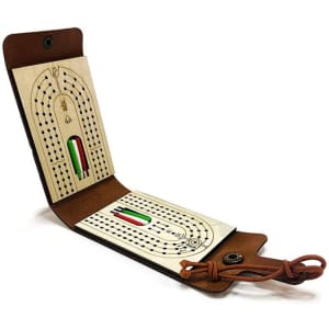 A leather travel cribbage board with a light-coloured wooden playing surface, featuring a decorative design and a brown leather cover.