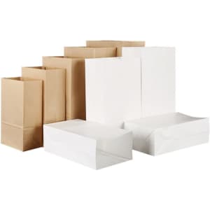 A variety of brown and white paper bags in different sizes, some flat and some upright, with branding present.
