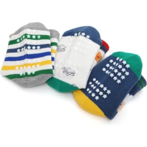 A set of custom kids' socks featuring various colourful patterns, including stripes and playful designs, with a logo on them.