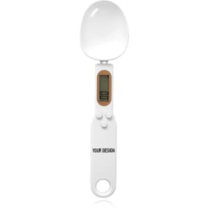 A digital measuring spoon in white with a digital display and buttons, featuring a keyring attachment.