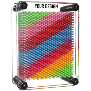 A 3D pin art toy featuring vibrant pink, green, and blue pins arranged in a geometric pattern within a clear frame.