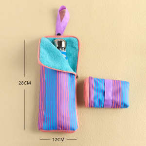 A waterproof storage pouch in vibrant blue and pink stripes, featuring a zip closure and a hanging loop.