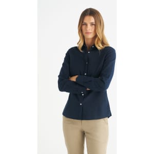 A long sleeve shirt in navy blue with a button-up front and a logo, styled for women.