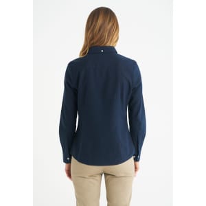 A navy blue ladies long sleeve button-up shirt with a fitted design and a collar. It has a logo on the back.