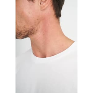A white men's t-shirt displayed on a model, focusing on the neckline and shoulder area.