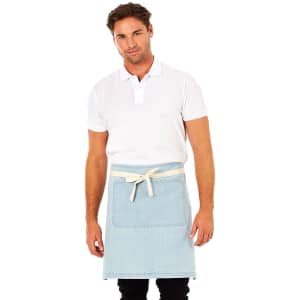 A man wearing a white polo shirt and a light blue denim apron stands against a white background.