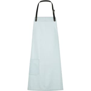 A light blue bib apron with a black strap and a front pocket, featuring a logo.