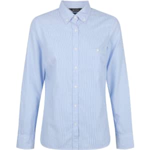 A light blue, long sleeve button-up shirt with a collar and a front pocket. Features a logo on the label.