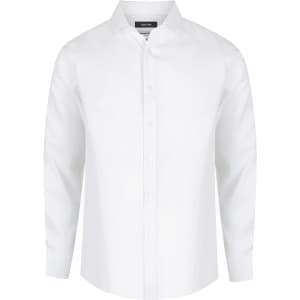 A white long sleeve button-up shirt with a collar, featuring a logo on the label.