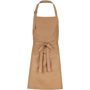 A tan bib apron with a waist tie, adjustable neck strap, and front pockets. It features a logo.
