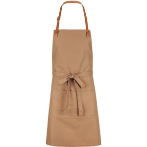 A tan bib apron with brown leather straps and a front pocket, featuring a simple design.