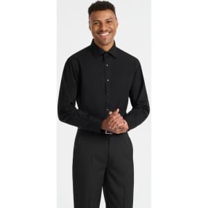A black long sleeve button-up shirt on a smiling model, featuring a subtle logo on the chest area.