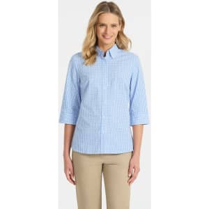 A blue and white checked ladies' 3/4 sleeve button-up shirt with a collar, featuring a logo.