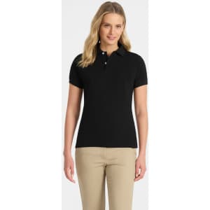 A black ladies' polo shirt displayed on a woman, featuring a collar and short sleeves. The shirt has a logo.