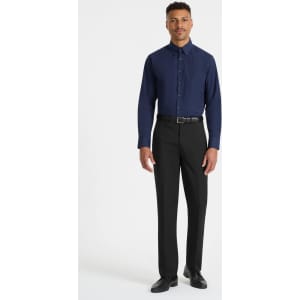 A men’s long sleeve button-up shirt in navy blue, paired with black trousers. The shirt has a logo.
