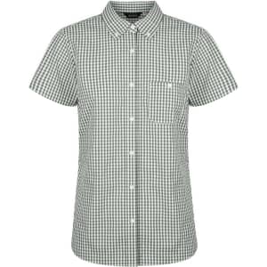 A green and white checked short sleeve button-up shirt for ladies with a pocket and a logo.