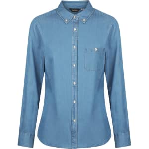 A light blue ladies long sleeve button-up shirt featuring a collar and a chest pocket. Includes a logo.