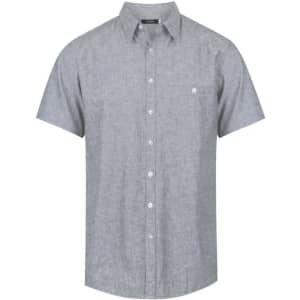 A grey short sleeve button-up shirt with a single pocket and a logo on the upper left side.