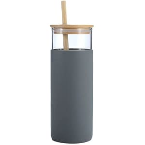 A drink bottle in grey with a bamboo lid and a straw, featuring a transparent glass body.