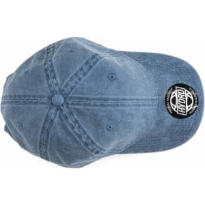 A blue cap with a rounded crown and a branded patch on the side.