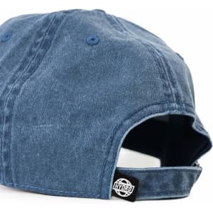 A blue denim cap featuring a logo on the side and an adjustable strap at the back.
