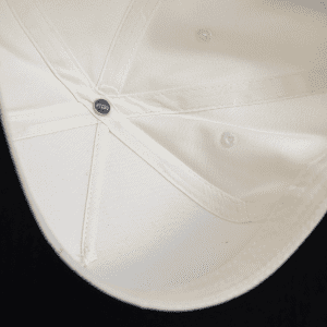A two-tone cap in white and black, featuring an interior view showing its structured design and a logo.