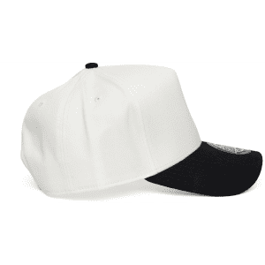 A two-tone cap in white and black with a visible logo, featuring a structured design and flat brim.