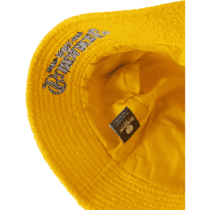 A yellow Terry Bucket Hat with a textured surface and an inner lining. It features a logo inside.