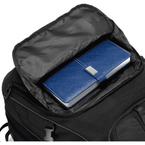 A black backpack with a partially open compartment revealing a blue notebook inside. The backpack features a logo.