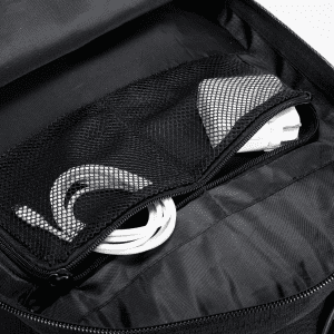 A black backpack interior featuring a mesh pocket containing white cables and additional gear.