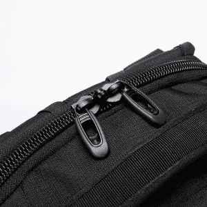 A black backpack featuring sturdy zippers and textured fabric details, with a logo present on the surface.