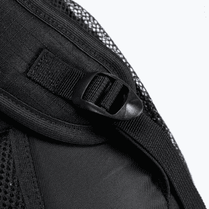 A close-up of a black backpack strap with a mesh overlay and a clip attachment.