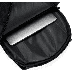A black backpack interior reveals a laptop compartment, with a sleek grey laptop neatly stored inside.