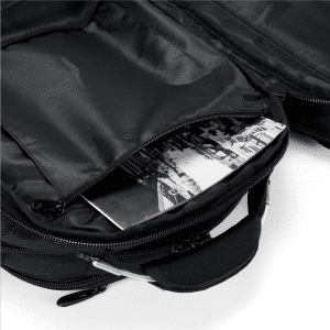 A black backpack with a zippered compartment, revealing a black-and-white photograph inside. It features a logo on the exterior.