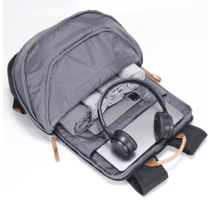 A grey Fairweather Backpack open to reveal a laptop, headphones, and a rolled blanket inside. It has a logo.