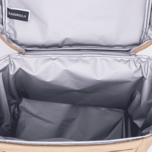 A tan cooler bag with a silver insulated interior, featuring a branded tag inside the lid.
